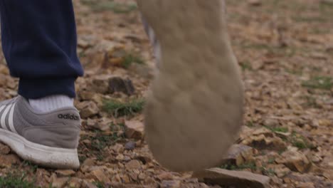 person walking on a rocky trail