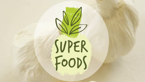 animation of super foods text over garlic on white background