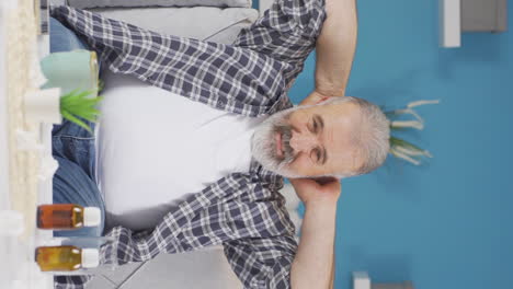 Vertical-video-of-Sick-old-man-suffering-from-neck-pain.