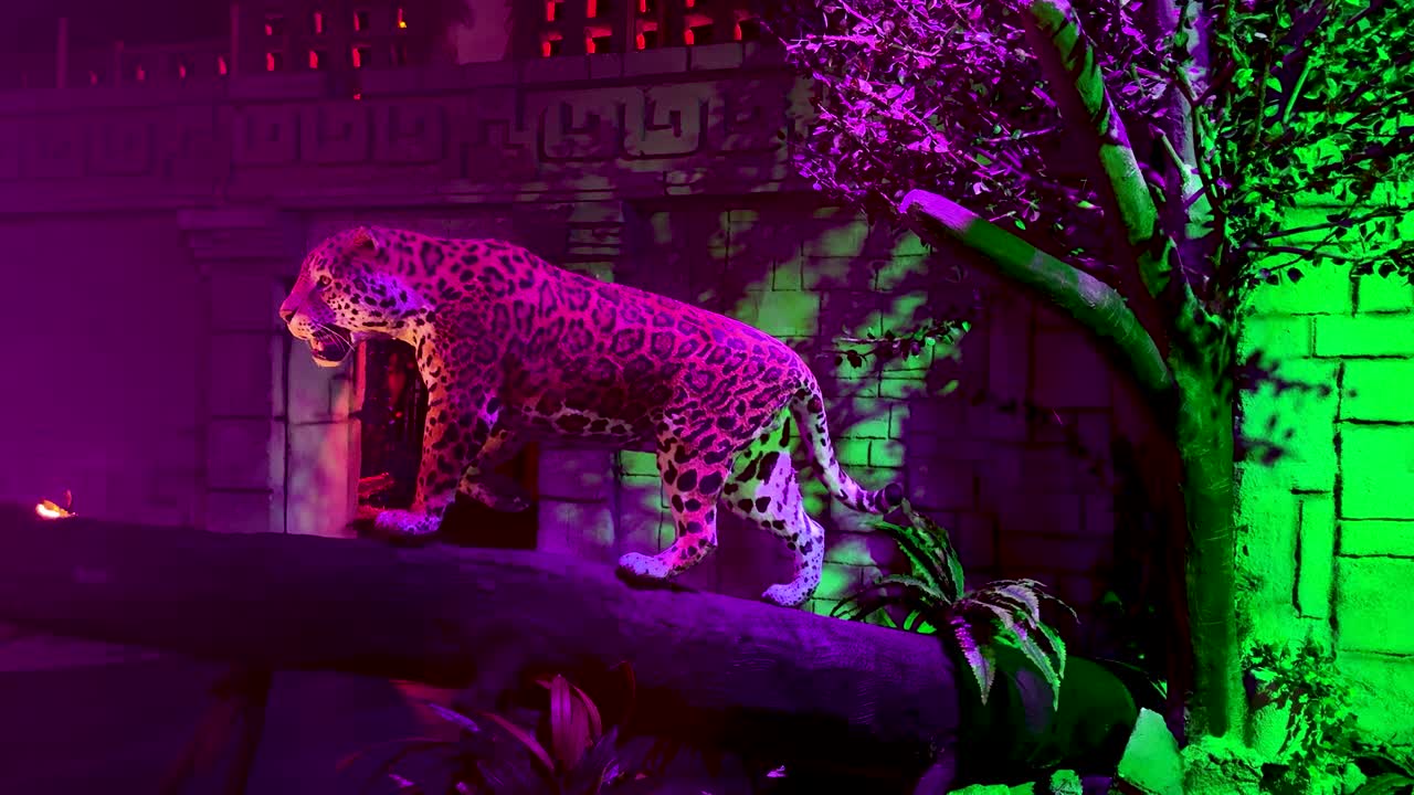 Jaguar statue with jungle colorful background