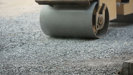 road roller on the road construction laying gravel