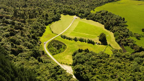 Dunsdale-Recreational-Reserve-with-forest-and-green-meadows,-aerial-view