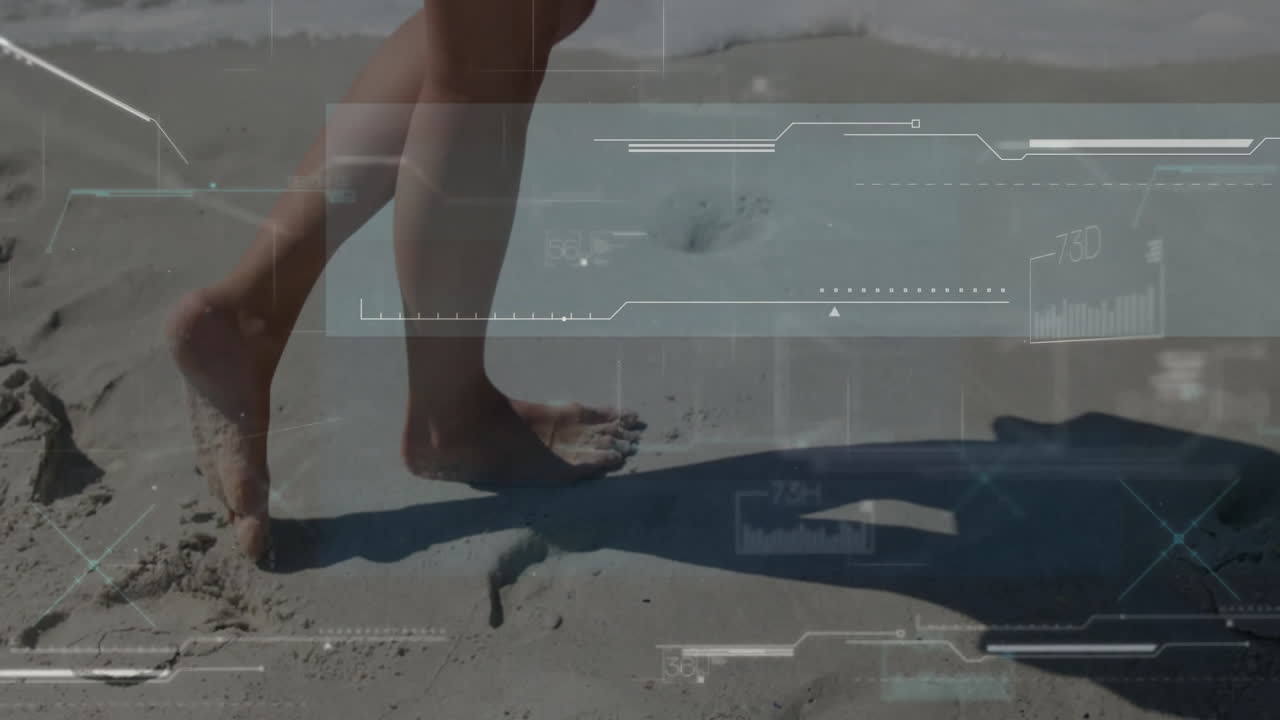 Barefoot person walking on sand with digital interface overlay animation