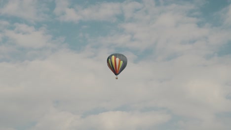 hot air balloon flying above teotihuacan, mexico - low angle shot