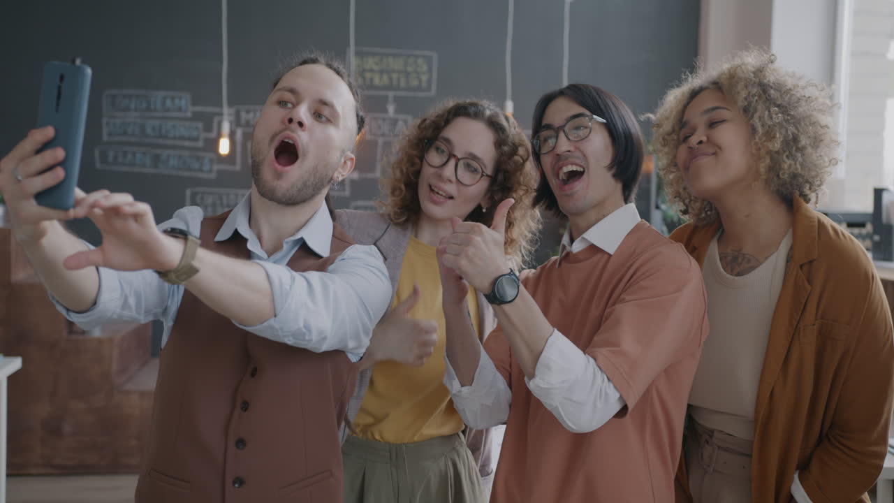 Happy Group Selfie in Modern Office