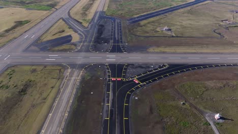 Empty-airstrip-of-Keflavik-international-airport-in-Iceland,-aerial