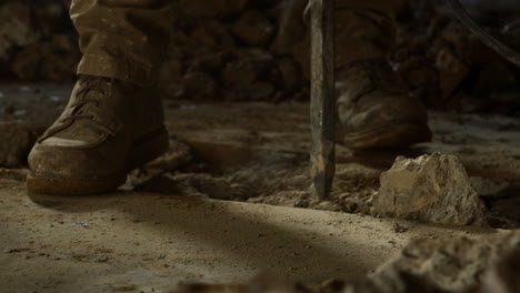 construction worker using jackhammer to break concrete
