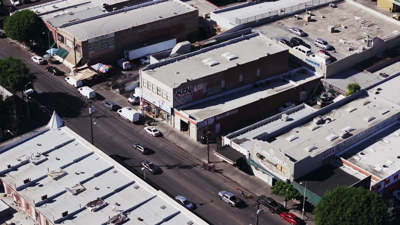 Aerial View of an Urban Street with Buildings and Vehicles