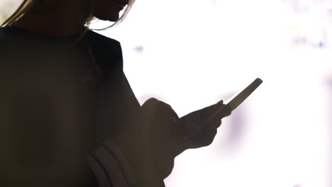 black silhouette of a woman with pad