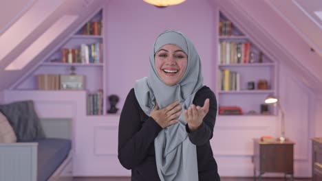 Happy-Muslim-woman-laughing-on-someone