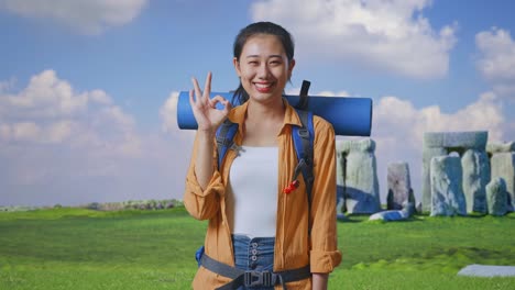 happy tourist woman at stonehenge