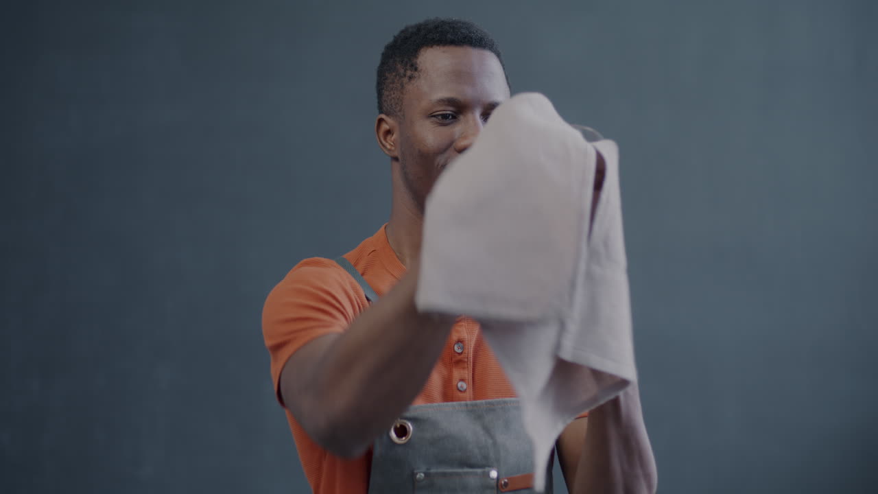 Man cleaning a wine glass