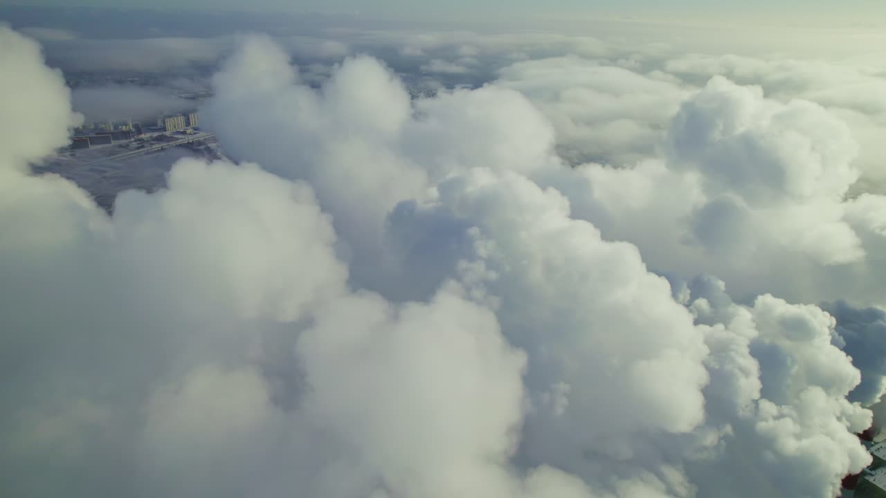 Aerial view of city with clouds and smoke