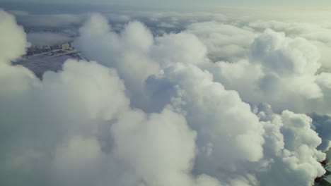 aerial view of city with clouds and smoke