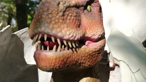 dinosaur among the trees in the park dinosaur among the trees in the park robotic model at the exhibition jurassic amusement park