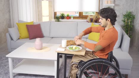 disabled young man eating in a wheelchair.