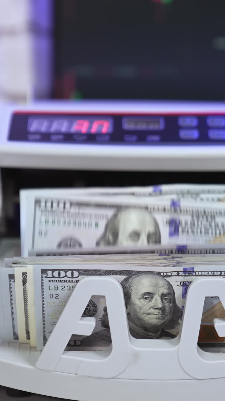 Automatic counting hundred dollars. Monetary banking cash calculating. Unrecognizable person taking money Vertical video
