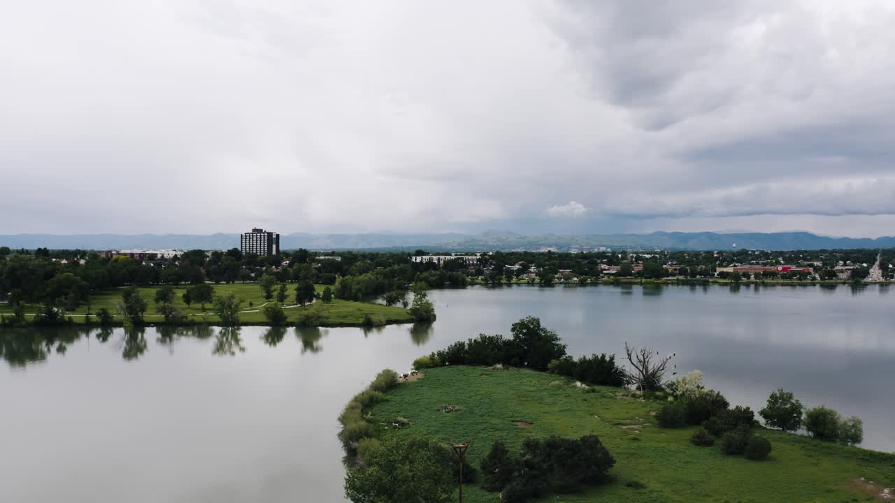 Drone shot flying over Penny Island in the middle of Sloan's Lake