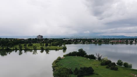 Drone-shot-flying-over-Penny-Island-in-the-middle-of-Sloan's-Lake