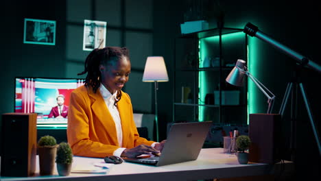 Dedicated-woman-diligently-typing-on-laptop-in-the-comfort-of-her-home-office