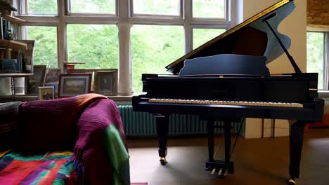 cozy study with piano and garden view