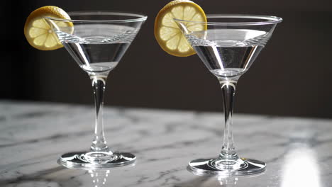 two martini cocktails with lemon slices
