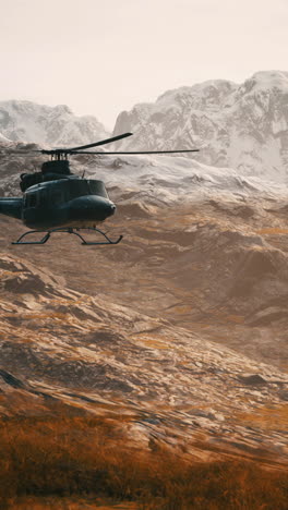 helicopter flying over snowy mountains