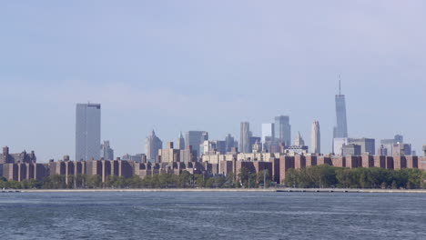 the financial district in manhattan, new york city from across the east river in williamsburg, brooklyn