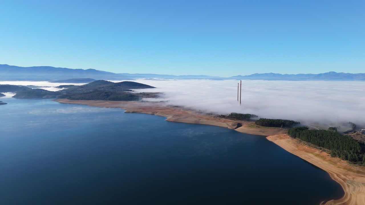 Lake landscape with fog and mountains