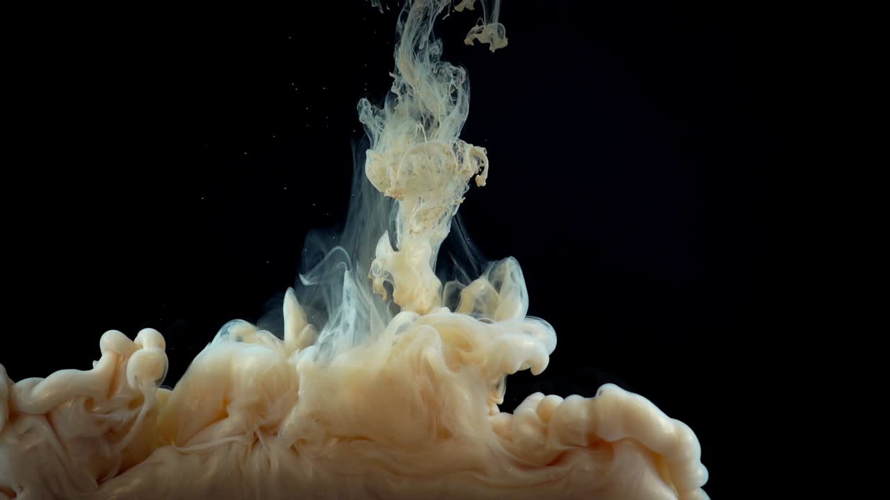 Paints. Abstract forms. Shooting on a black background