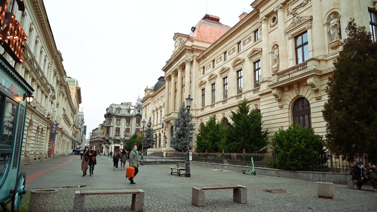 Bucharest, Romania - December 21, 2021: People walking on the streets of the Old Town of Bucharest, Romania