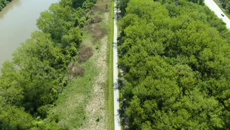 bird's eye view over cyclists on a bike trail in the forest