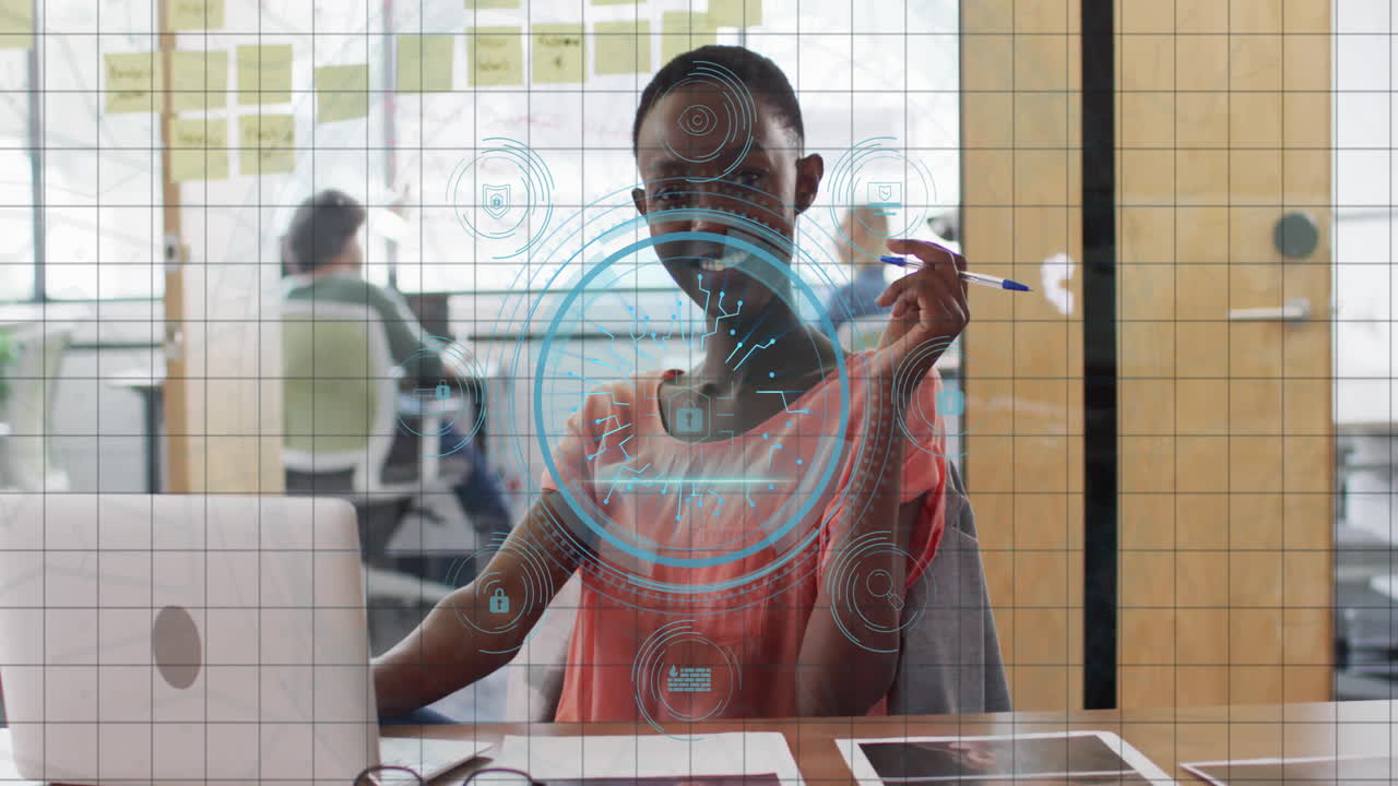 At desk, person working with animation of digital security interface in school