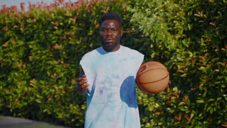 man playing basketball outdoors