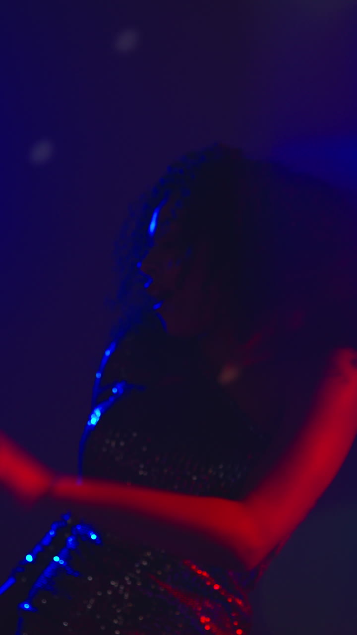 Vertical Video Of Young Woman In Nightclub Bar Or Disco Dancing With Sparkling Lights In Background 2