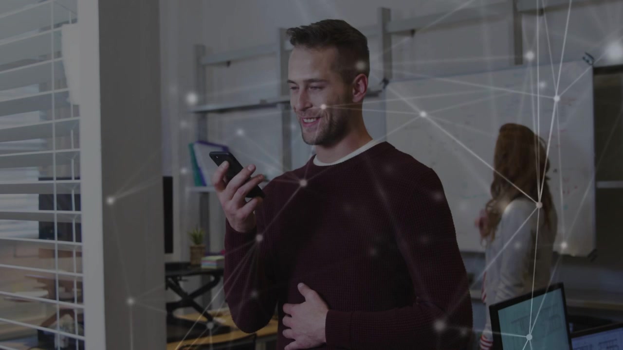 Vertical video: Man tapping phone and talking reading note as nodes overlaying business whiteboard