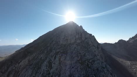 sunshine over mountain peak in spain, aerial view