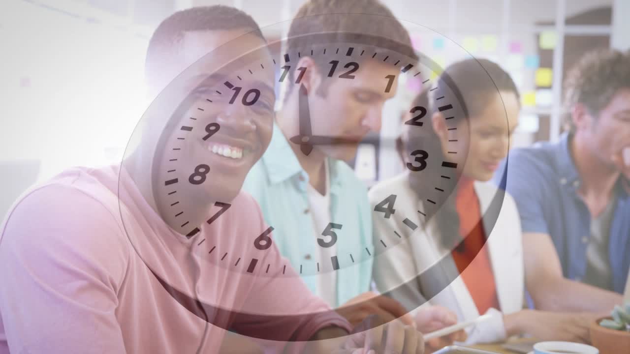 Analog clock graphic appearing above guiding tech team typing and scrolling, showing time and unity