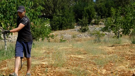 gardener collects garden drip