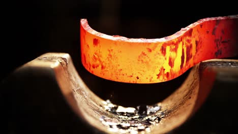 close-up of blacksmith working on a iron rod