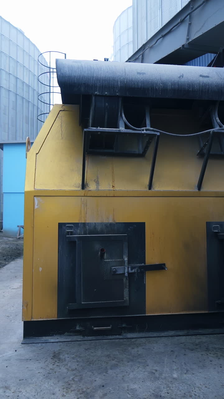 Industrial pellet stoves in work. Industrial pellet stoves in work, alternative biofuel for heating stoves and boilers. Vertical video
