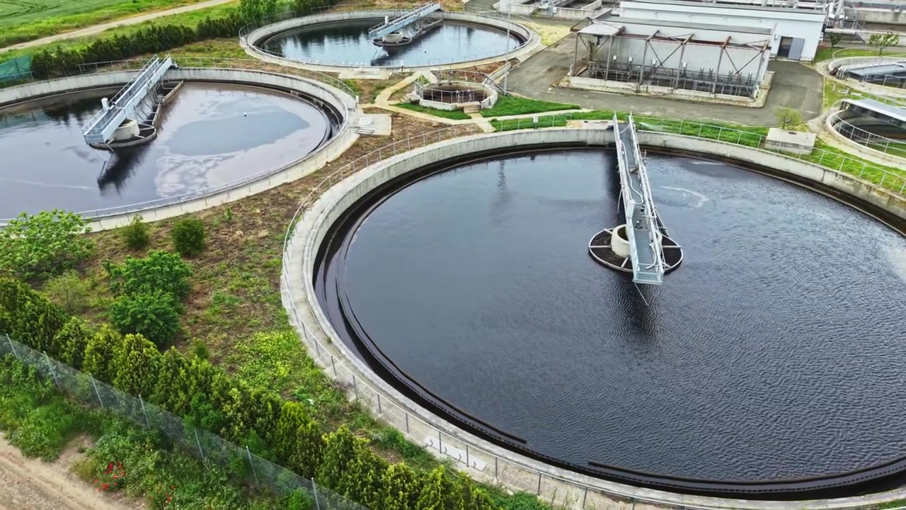 Eco water treatment. Drone perspective showing ecological wastewater processing infrastructure. Surrounding nature with advanced wastewater clarification and recycling facilities