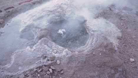 el tatio geysers boiling in slow motion in the atacama desert in chile, south america