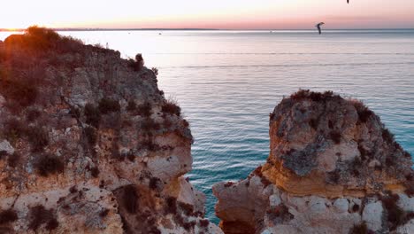 stunning aerial view of the tranquil coastline in portugal at sunset