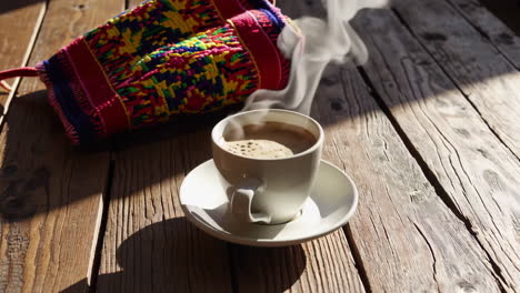 coffee and colorful textile on wooden table