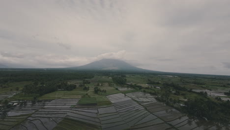 drone shot moving toward mayon volcano