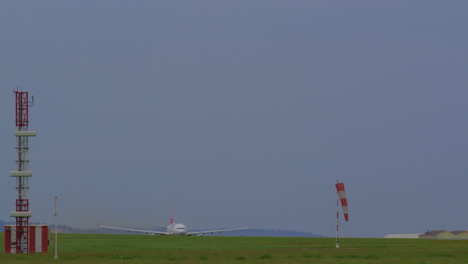 airplane landing on a cloudy day