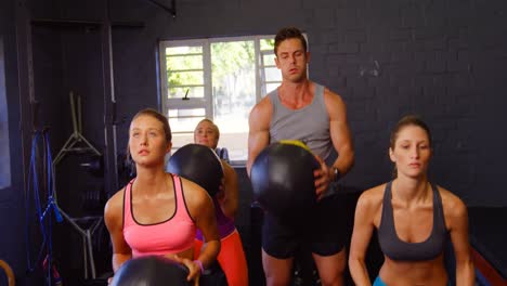 Group-of-people-exercising-with-ball