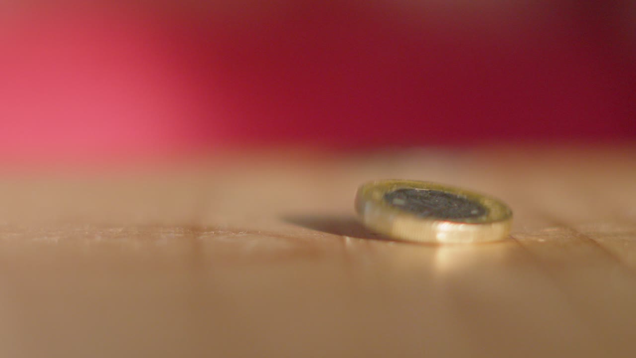 British Pound Pound Sterling Coin Spinning and Toppling Over. Illustration Example of Unstable Currency Economic Markets and Potential Baking System Crashes.