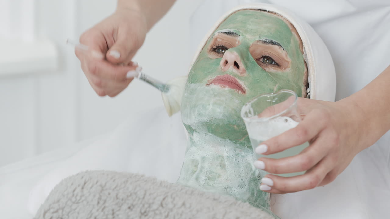 Woman receiving a facial beauty treatment